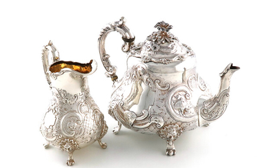 λA Victorian silver teapot and cream jug