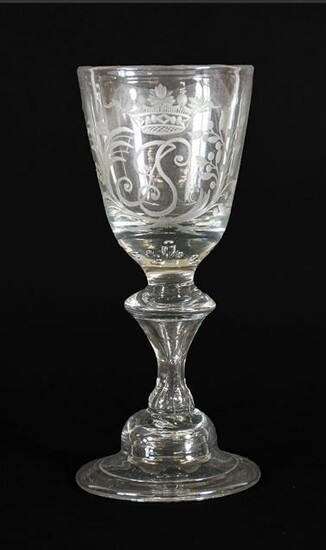 A Wine Glass, circa 1730, the rounded funnel bowl engraved...