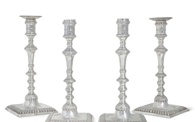 A assembled set of George III silver candlesticks