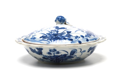 A blue and white porcelain covered bowl painted with mandarin ducks among lotus flowers, design shaped with peach at handle