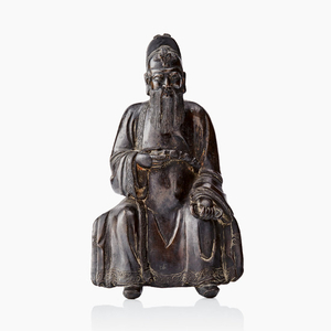 A bronze figure of a seated Daoist deity
