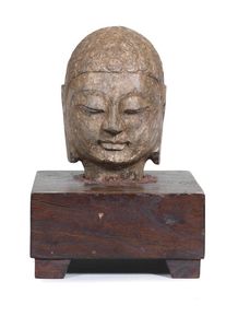 A carved stone head of Buddha