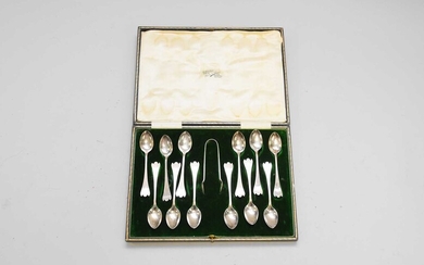 A cased set of twelve stylised trefid silver teapsoons with sugar tongs
