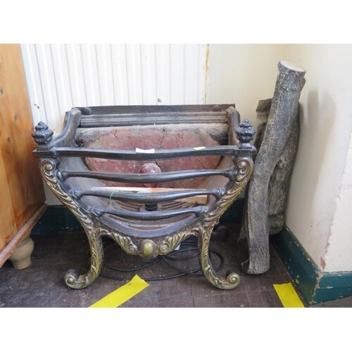 A cast iron fire basket, with brass finish acanthus scroll f...