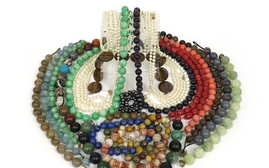 λ A collection of seventeen bead necklaces, including...