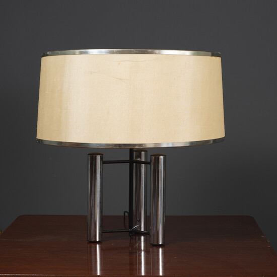 A contemporary chrome plated table lamp
