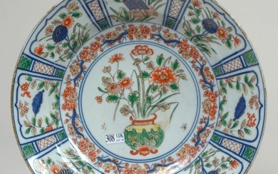 A deep dish in Imari polychrome porcelain decorated...