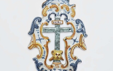 A faience holy water stoop with a crucifix