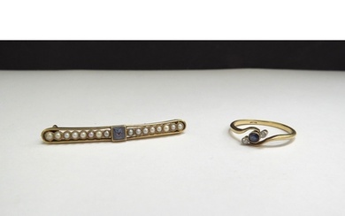 A gold bar brooch centrally set with a square sapphire flank...
