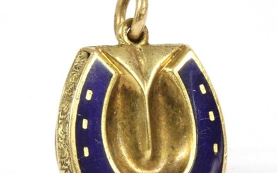 A gold enamel horseshoe locket