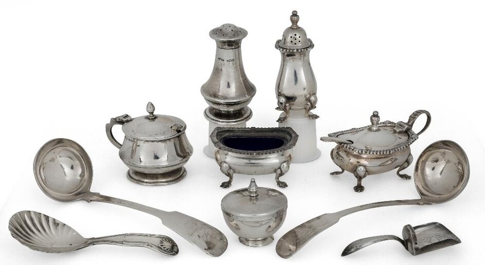 A group of silver cruets and spoons comprising: a pair of Scottish silver sauce ladles, Edinburgh, 1830, Donald Fraser; a Georgian silver caddy spoon in the form of a coal shovel, Birmingham, 1809, maker's mark rubbed; a second silver caddy spoon...