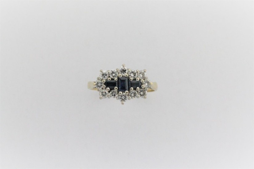 A ladies sapphire and diamond cluster ring, mounted with thr...