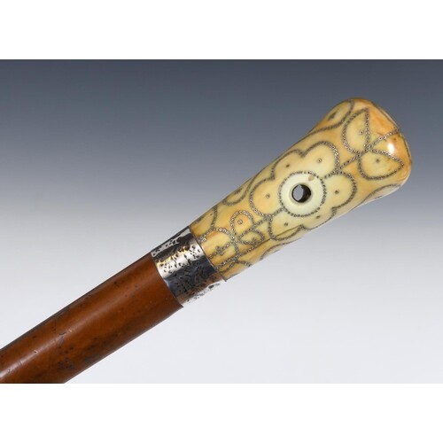 A late 17th/early 18th century walking stick, with a carved ...