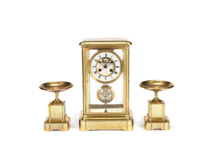 A late 19th century French lacquered brass four glass clock garniture indistinctly signed Levy, Paris, the movement stamped EB 3