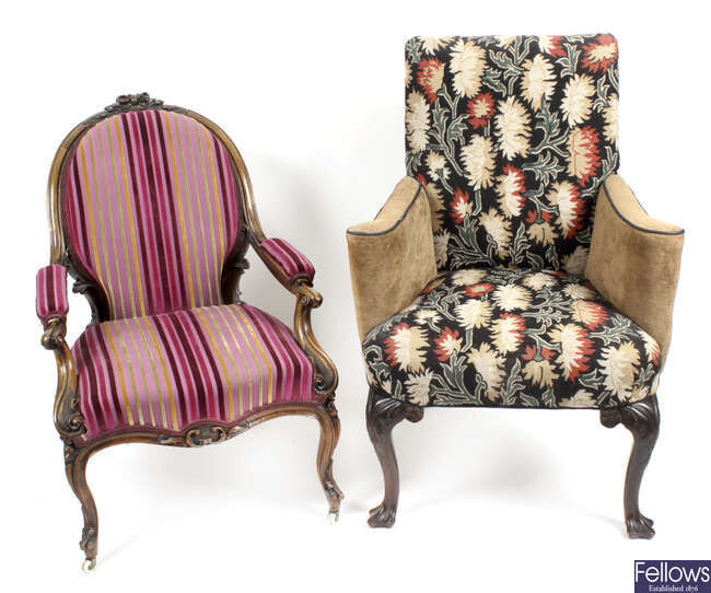 A late 19th century carved rosewood framed armchair, together with a reproduction Georgian style armchair.