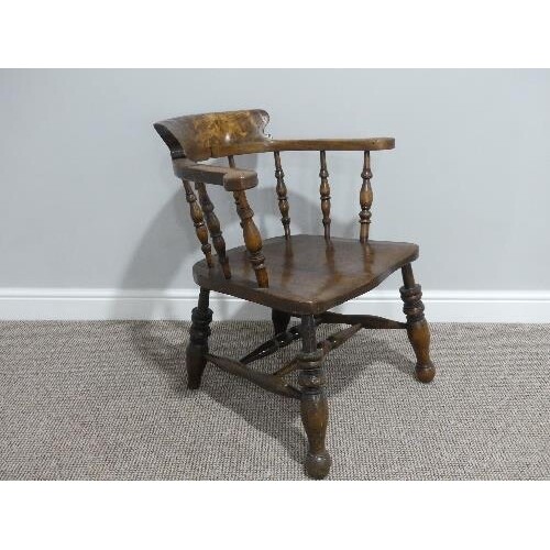 A late 19thC ash and elm smokers bow Armchair, with spindle ...