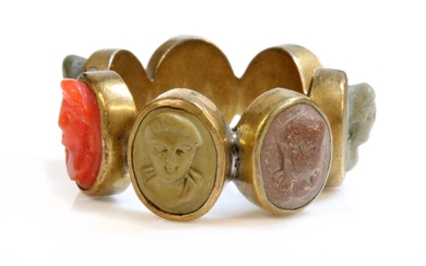 A late Georgian gilt metal specimen lava and coral cameo ring