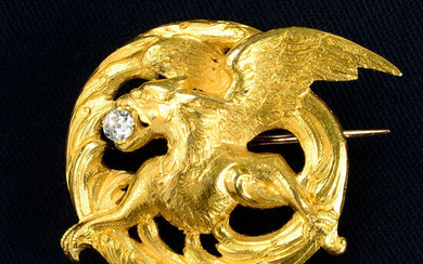 A late Victorian Art Nouveau 18ct gold griffin brooch, with old-cut diamond highlight.