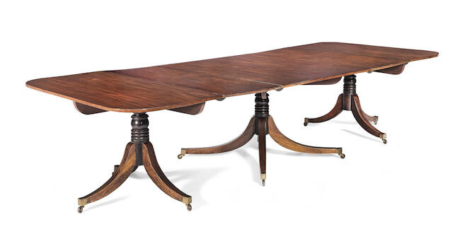 A mahogany triple pedestal dining table