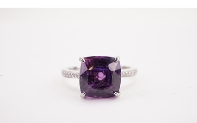 A natural purple sapphire and diamond set ring, set with a E...