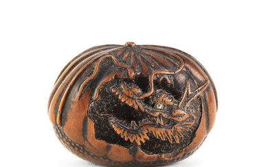 A netsuke of a dragon in a chestnut