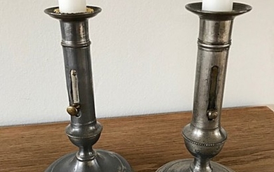 A pair of 19th century pewter candle sticks. H. 19 cm. (2)