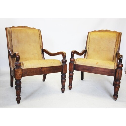 A pair of 19th century style hardwood plantation chairs, the...