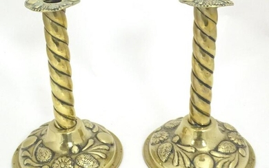 A pair of 19thC brass candlesticks with twist columns