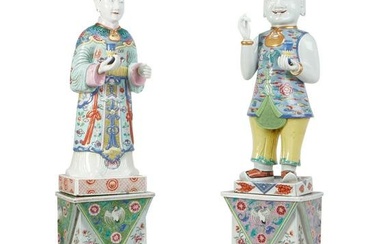 A pair of Chinese porcelain figural candlesticks