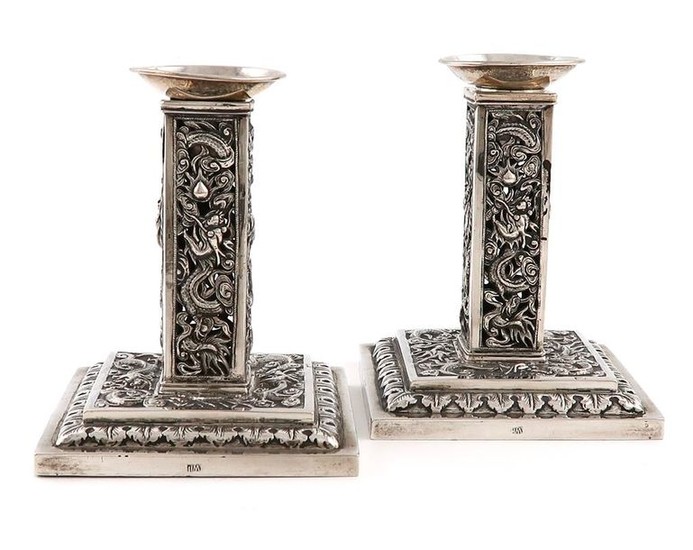 A pair of Chinese silver candlesticks, by Wang...