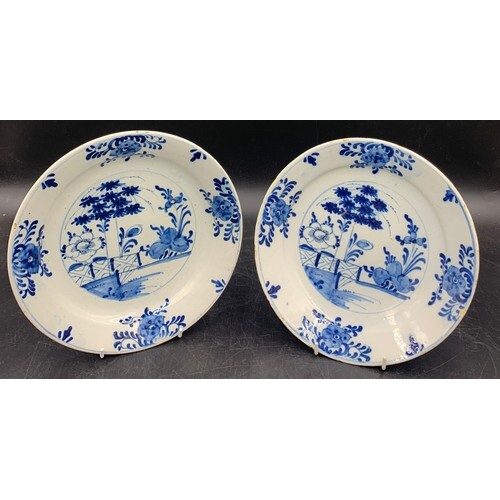 A pair of Dutch Delft pottery dishes of shallow form and dec...