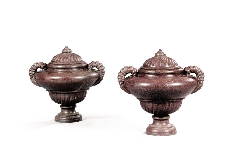 A pair of Roman Baroque style porphyry covered urns