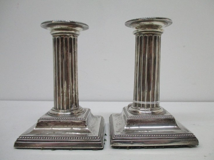 A pair of Victorian silver candlesticks by Hawksworth, Eyre ...