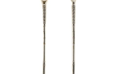 A pair of cast and silvered novelty golf iron and ball candlesticks