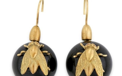 A pair of eighteen karat gold and black stone earrings