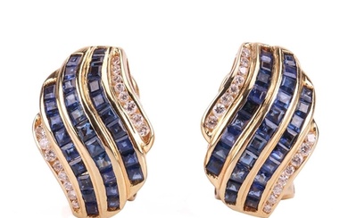 A pair of gem-set earclips, the curved rows set with calibre...