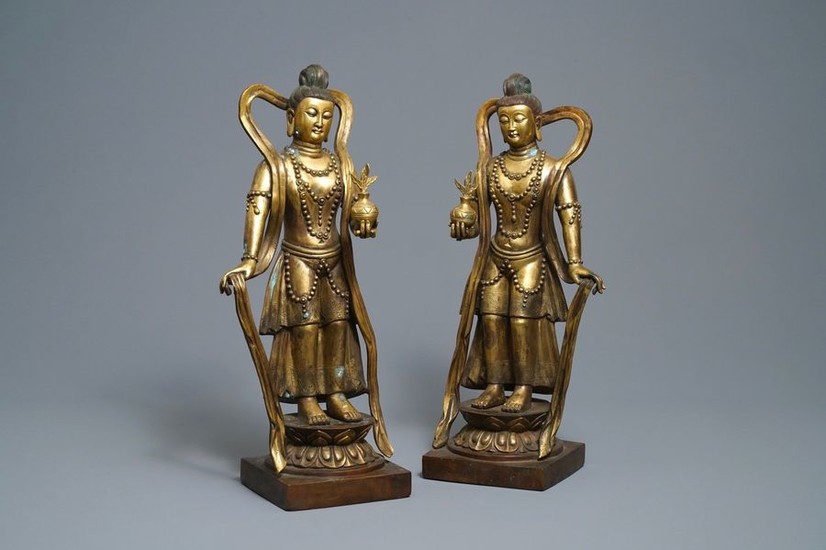 A pair of large Chinese gilt bronze figures,...