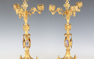 A pair of late 19th century French Gothic Revival cast ormolu four-light candelabra, each stem appli