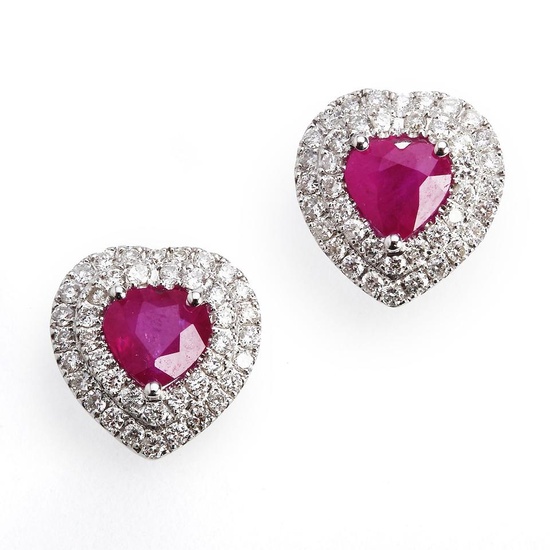 A pair of ruby and diamond ear studs in the...