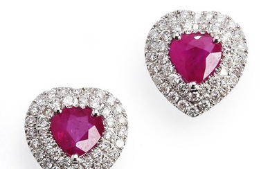 A pair of ruby and diamond ear studs in the...