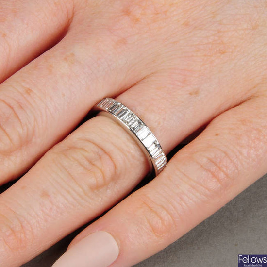A platinum baguette-cut diamond full eternity ring.