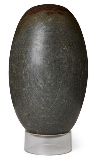 A polished lingham stone, of typical ovoid form, 34cm. long Provenance: Formerly in the collection of Werner Forman (1921-2010)