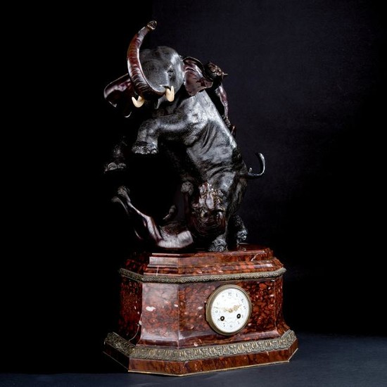 A red marble and patinated bronze mantel clock