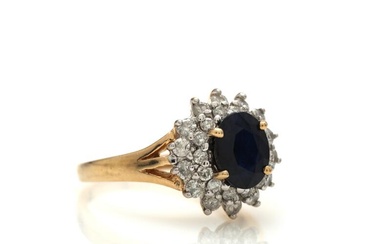 A sapphire-and diamond ring set with faceted sapphire weighing app. 1.50 ct....