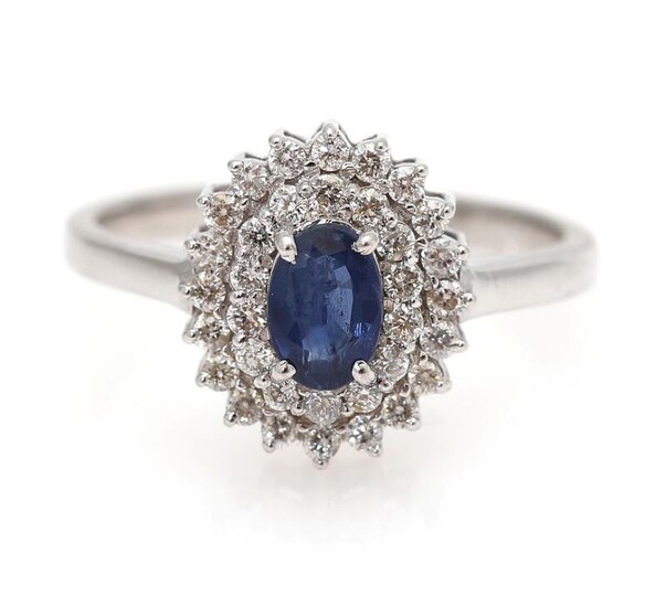 NOT SOLD. A sapphire ring set with a sapphire encircled by numerous diamonds, mounted in 14k white gold. Size 52. – Bruun Rasmussen Auctioneers of Fine Art