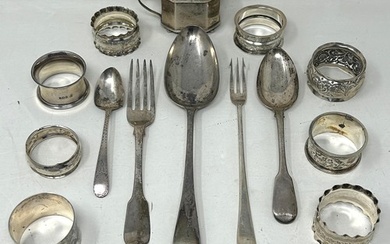 A silver Old English pattern spoon, assorted napkin rings, a...