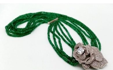 A very glamorous six strand faceted emerald necklace, with a...
