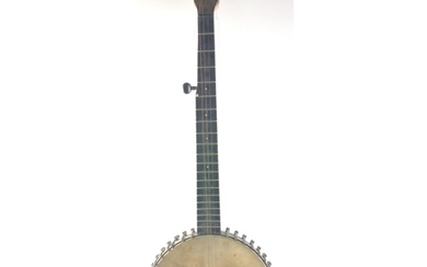 A vintage 5 string BANJO, all pegs intact, 1 string missing....