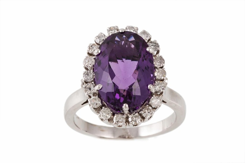 AN AMETHYST AND DIAMOND CLUSTER RING, the amethyst estimated...