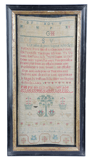 AN EARLY 18TH CENTURY FRENCH NEEDLEWORK SAMPLER